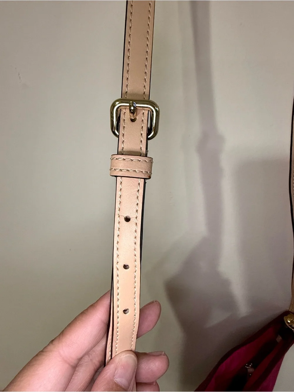 kate spade burgundy crossbody with beige strap and gold plaque